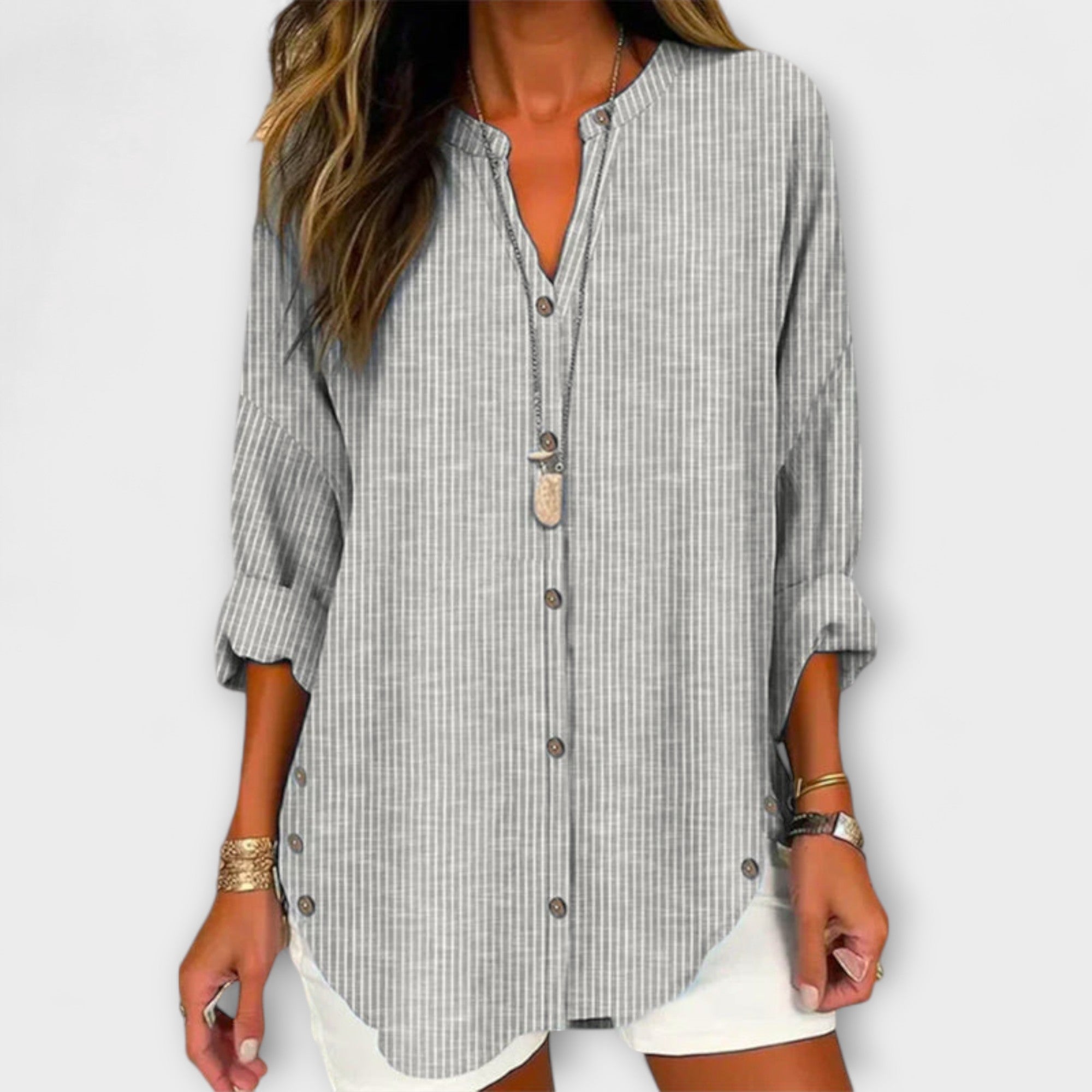 Lucida – Top elegante con scollatura a V e classico motivo a righe