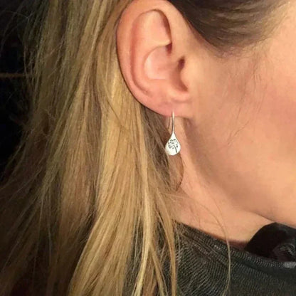 Eleganti orecchini in argento design foglia di dente di leone
